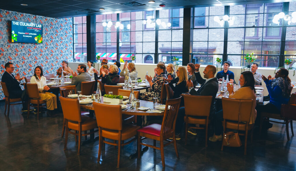 Interior Group Photo of People Seated in Restaurant